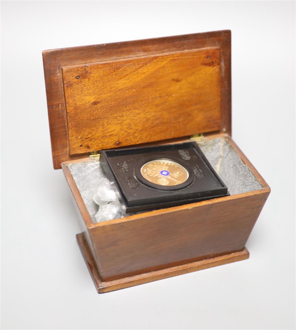 A mahogany box of world coins